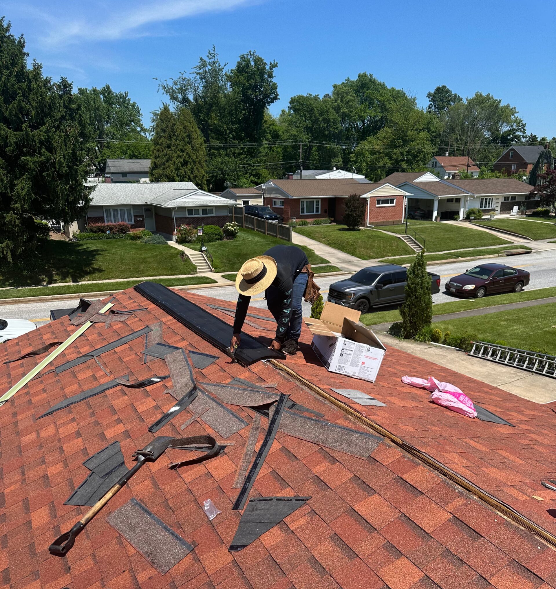 Roofing professional working on a residential roof installation